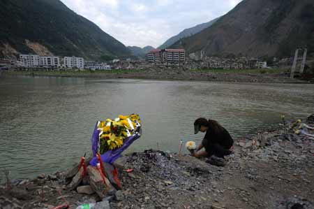 China opens quake-leveled county to mourners