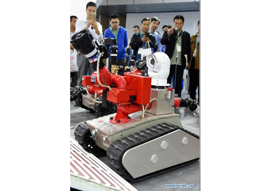 Robots dance, fight fire and serve meal at Henan expo