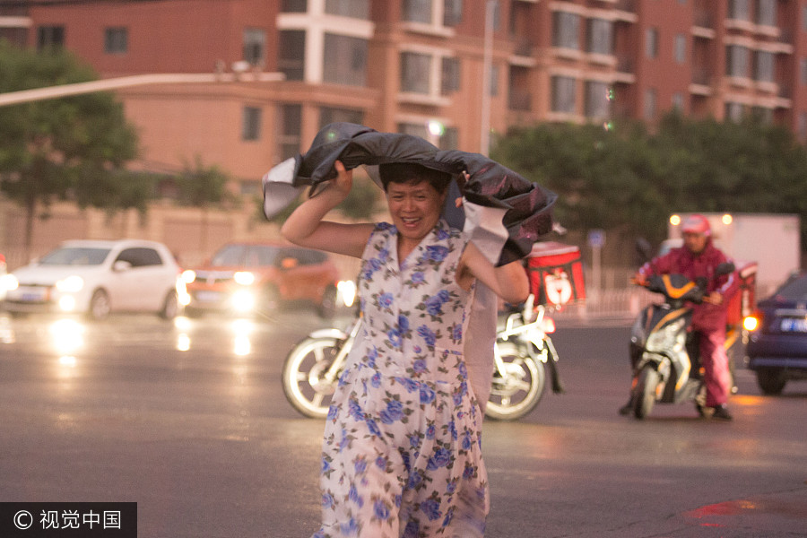 Heavy rains bring respite to scorching Beijing