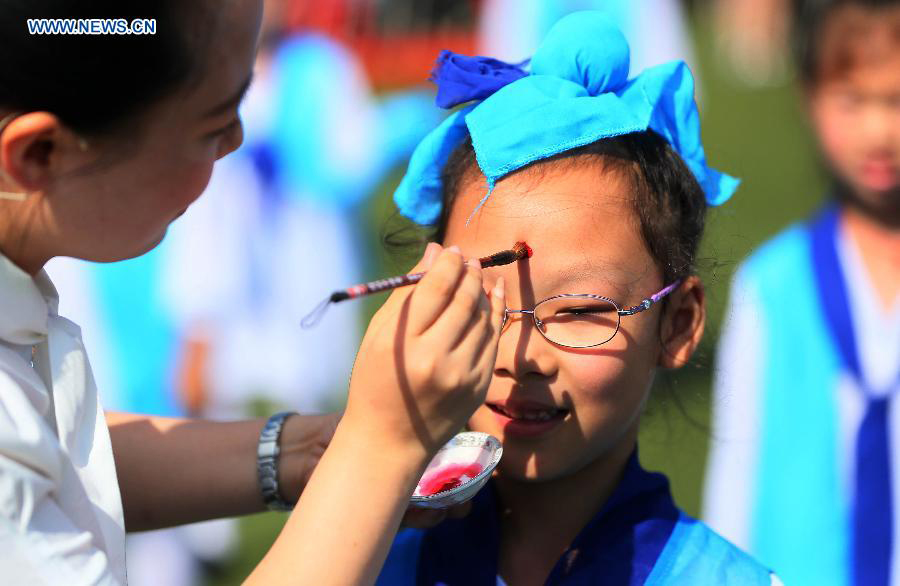 New first-graders attend traditional education activity in E China
