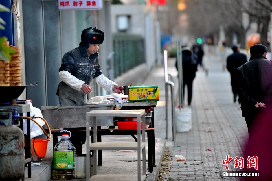 中国多地大风降温 京城迎入冬最冷一天