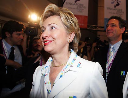 U.S. Senator and former first lady Hillary Clinton (L) and New York City Deputy Mayor and bid chief Dan Doctoroff (R) are seen after the announcement of the host of the 2012 Olympic Games in Singapore July 6, 2005.