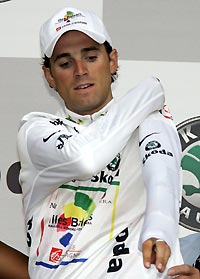 Illes Baleares team rider Alejandro Valverde of Spain wears the best junior's jersey on the podium after the 173km (107 miles) 11th stage of the 92nd Tour de France cycling race between Courchevel and Briancon, July 13, 2005.