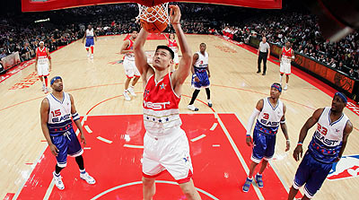 Western Conference center Yao Ming (C) gets a slam dunk during first half action against the Eastern Conference in the 55th NBA All-Star Game in Houston, Texas, February 19, 2006.
