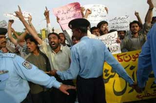 Protesters call for an end to the anti-al-Qaeda hunt
