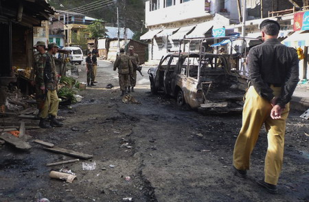 Pakistan police targeted as attacks kill 15