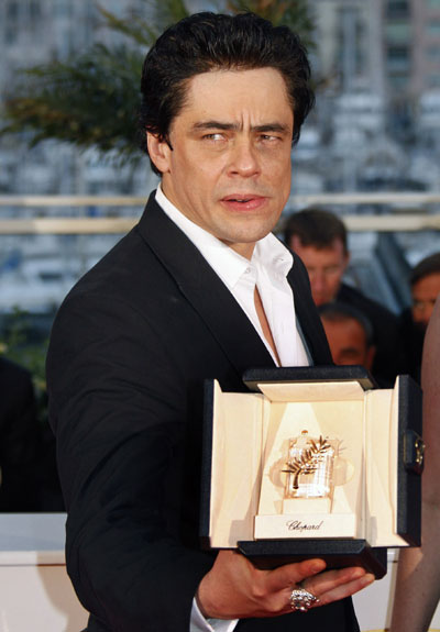 Actor Benicio Del Toro poses with the Best Actor award for the film 