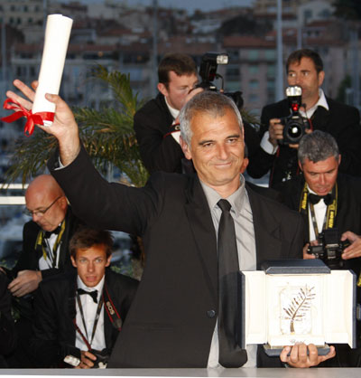 French director Cantet poses after he received the Palme d'Or award for the film 