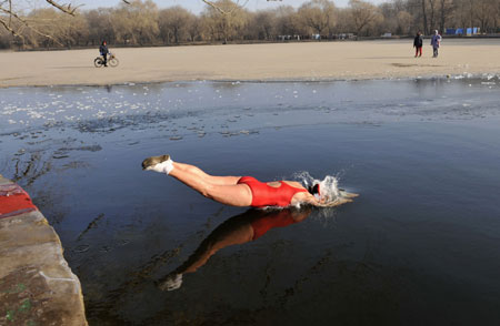 Women Winter Swimming Group in frozen lake
