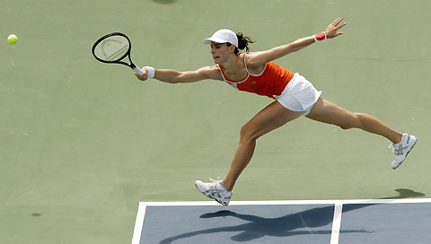 France's Nathalie Dechy chases a shot from Russia's Maria Kirilenko at the Rogers Cup tennis tournament in Montreal August 16, 2006.