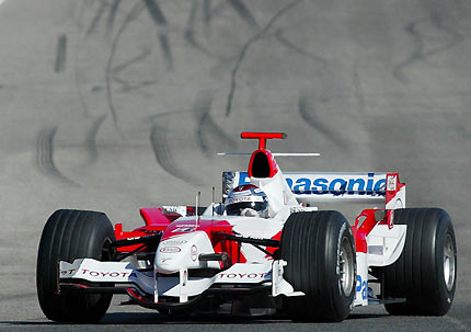 Toyota Formula One driver Jarno Trulli from Italy steers his TF106 through a curve during a training session at the Ricardo Tormo racetrack in Cheste, near Valencia, March 2, 2006.[Reuters]