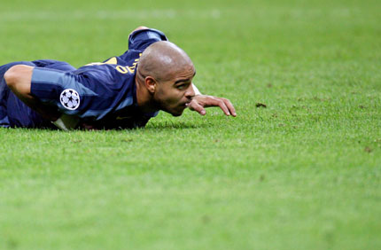 Inter Milan's Adriano lies on the pitch during the first leg of their Champions League quarter-final soccer match against Villarreal at San Siro stadium in Milan, northern Italy March 29, 2006. Inter Milan won the match 2-1.