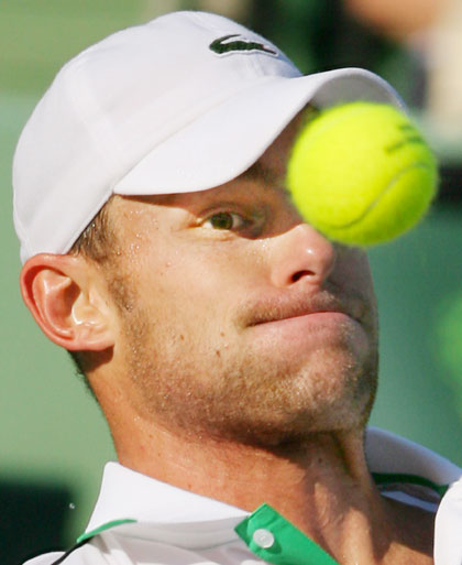 Andy Roddick of the U.S. eyes the ball during his quarter final match against David Ferrer of Spain at the Nasdaq-100 Open tennis tournament in Key Biscayne, Florida, March 30, 2006. 