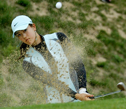 American golfer Michelle Wie plays her ball from a bunker on the 16th hole on the second day of SK Telecom Open 2006 golf tournament at the Sky 72 Golf Club in Inchon, west of Seoul, May 5, 2006. 