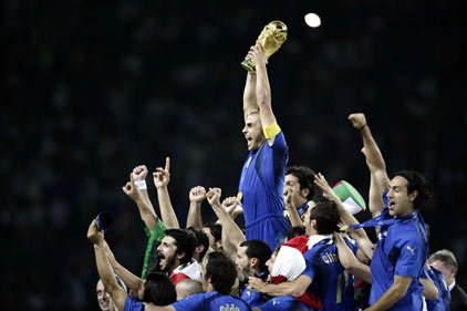 Italy's Fabio Cannavaro lifts the World Cup Trophy after the World Cup 2006 final soccer match between Italy and France in Berlin July 9, 2006. 