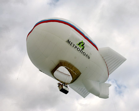 An airship with aeronaut Stanislav Fyodorov of Russia on board lifts in the sky as he trains for setting a new world record 70 km (43 miles) east of Moscow, August 11, 2006. Fyodorov wishes to set a new altitude world record for airships, lifting his airship higher than 9,000 meters (29,527 feet) in mid August. 