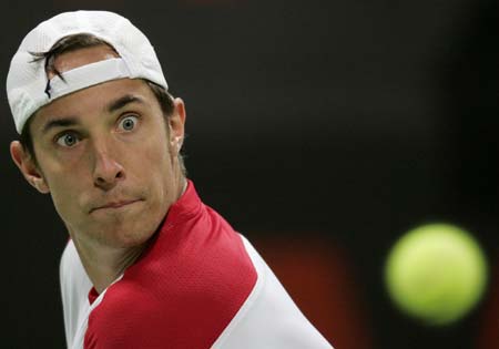 Denis Gremelmayr of Germany returns the ball to Ivan Ljubicic of Croatia during the Qatar Open tennis tournament in Doha January 2, 2007. 