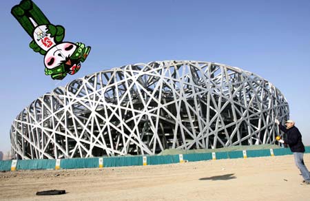 A man flies a kite of Nini, one of the five official mascots of the Beijing 2008 Olympic Games, near the construction site for the National Olympic Stadium during a photo opportunity in Beijing February 1, 2007. Beijing has warned government and Olympic officials not to shame the country during the 2008 Games through corruption or immoral behaviour, state media reported. 