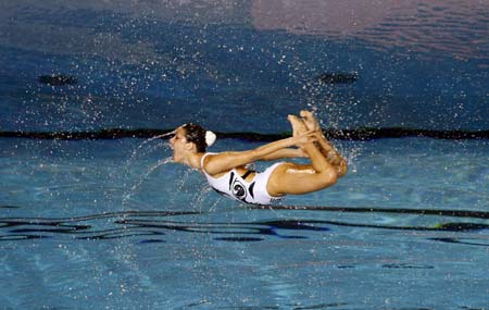 A member of the Spanish team performs in the synchronised swimming free combination routine preliminary round at the World Aquatics Championships at Rod Laver Arena in Melbourne March 17, 2007. 