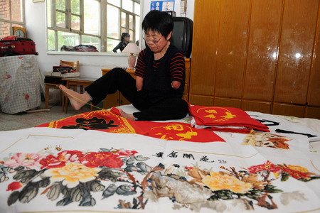 Armless embroiderer heads to Expo for exhibition
