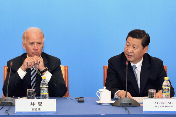 Xi, Biden talk business issues in Beijing