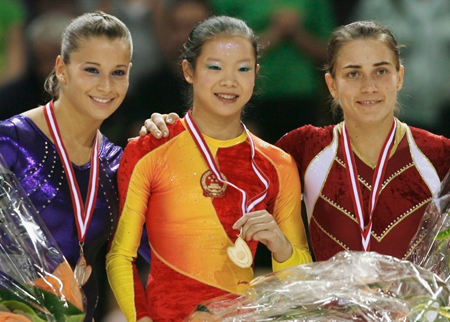 Chinese add three golds to double haul at gymnastics worlds