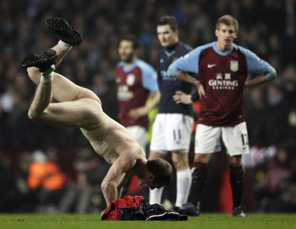 Streaker invades as Man City back to the top