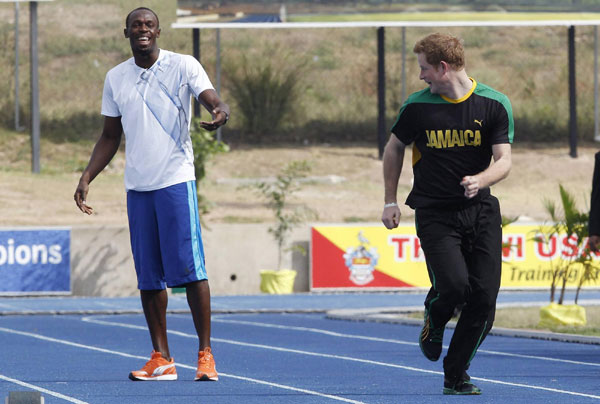 Prince Harry runs with Usain Bolt in Jamaica