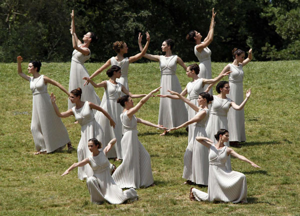 London Olympics flame lit in Olympia, torch relay begins