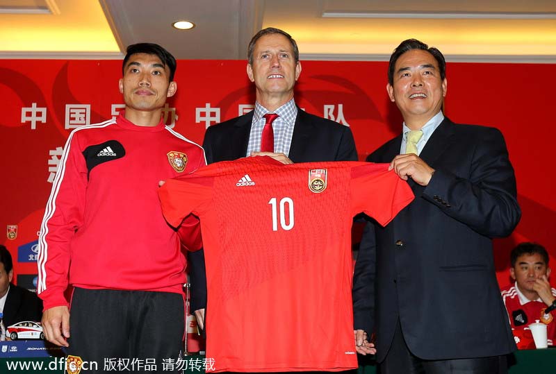 In photos: Frenchman Perrin named coach of Chinese soccer team