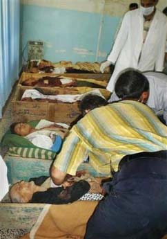 Some of the dead lie in the morgue of the hospital in the town of Kalar, after gunmen killed 21 people including many high school students and wounded one on Sunday after dragging passengers off buses in the town of Ain Laila, inbetween Qara Tappah and Baqouba, in Iraq Sunday, June 4, 2006. Four Sunni Arabs on board were spared and the dead were all either Shiites or Kurds. (AP Photo)