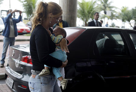 Distraught relatives wait for information at Brazil hotel
