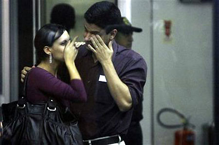 Distraught relatives wait for information at Brazil hotel