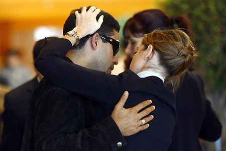 Distraught relatives wait for information at Brazil hotel