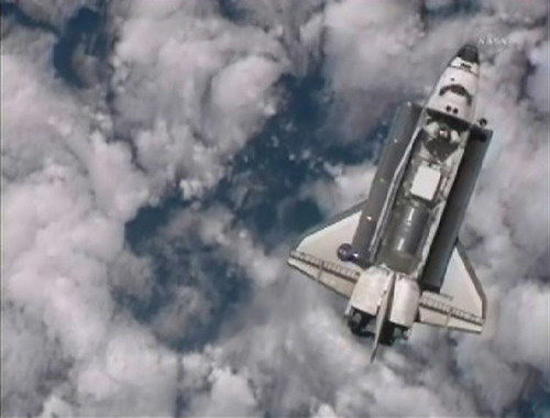 Discovery docks at space station on final voyage